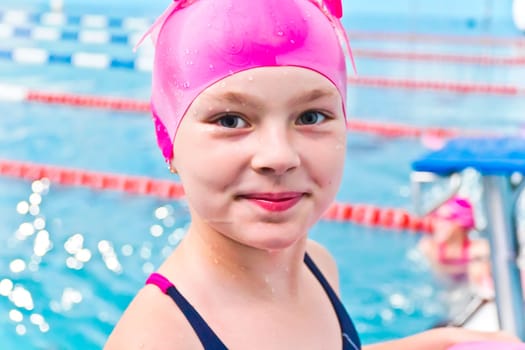 Photo of cute girl in swimming pool