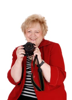 A happy and lovely senior grandmother holding a camera and taking.pictures, isolated for white background..