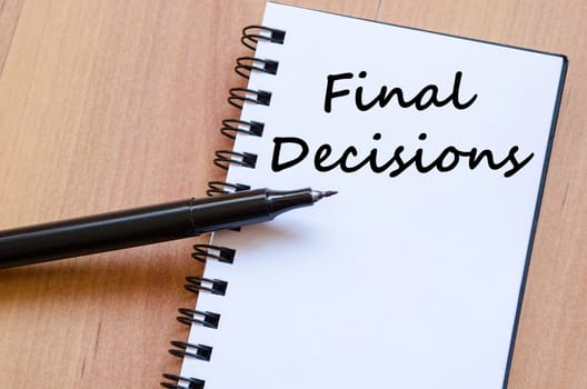 Final decisions text concept write on notebook with pen