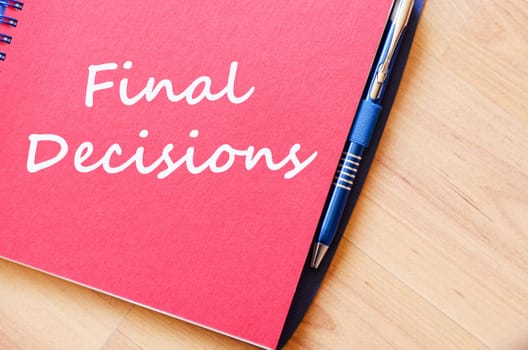 Final decisions text concept write on notebook with pen