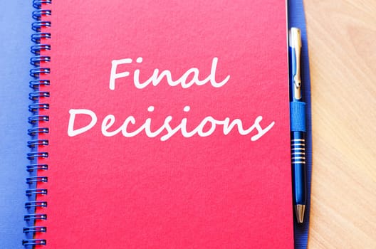 Final decisions text concept write on notebook with pen