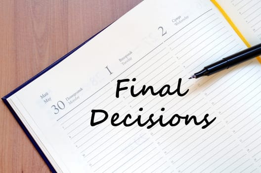 Final decisions text concept write on notebook with pen