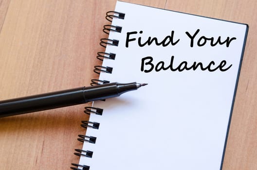 Find your balance text concept write on notebook with pen