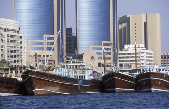 Import and export goods at the harbour at the Dubai creek in the old town in the city of Dubai in the Arab Emirates in the Gulf of Arabia.