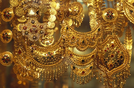 a Gold shop the souq or Market in the old town in the city of Dubai in the Arab Emirates in the Gulf of Arabia.