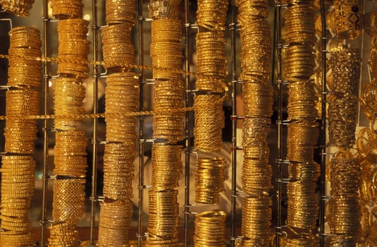 a Gold shop the souq or Market in the old town in the city of Dubai in the Arab Emirates in the Gulf of Arabia.