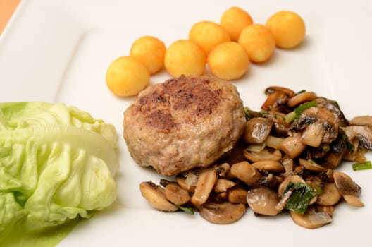 Burger with mushrooms and spicy potatoes