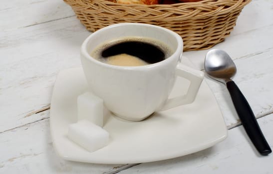 French breakfast with coffee and pastries on white table