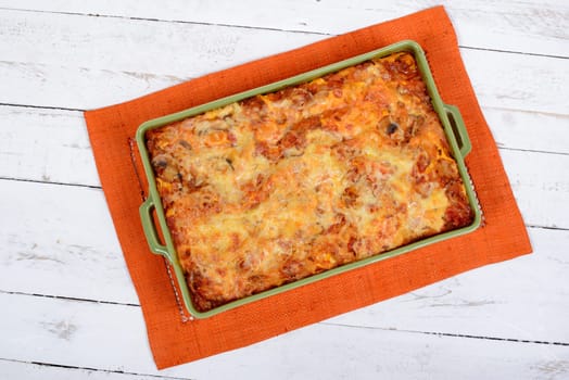 lasagna dish on orange towel