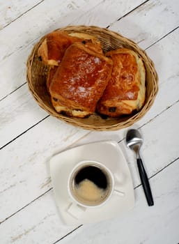 French breakfast with coffee and pastries on white table