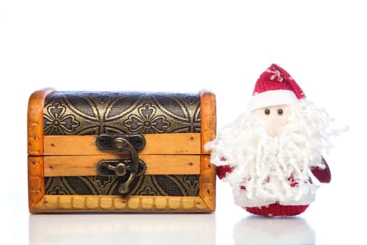 Christmas Santa Claus or Father Frost and wooden chest on white background with reflection