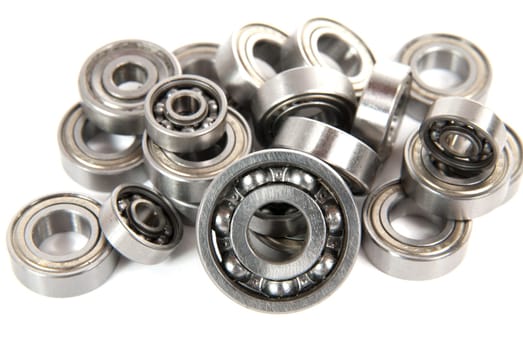 lot of small ball bearings on the white background