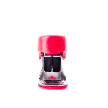 A miniture red stapler viewed from the front on a white background.