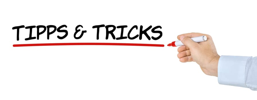 Hand with pen writes tips and tricks