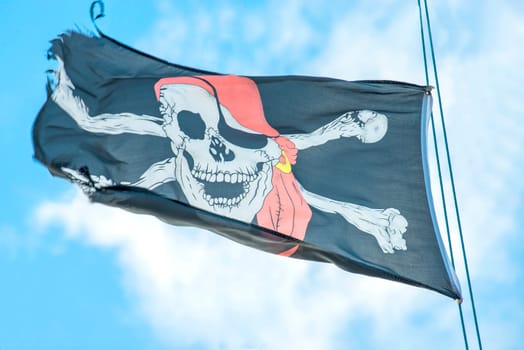 Pirate flag on the sailing ship.