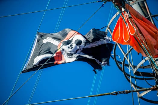 Pirate flag on the sailing ship.