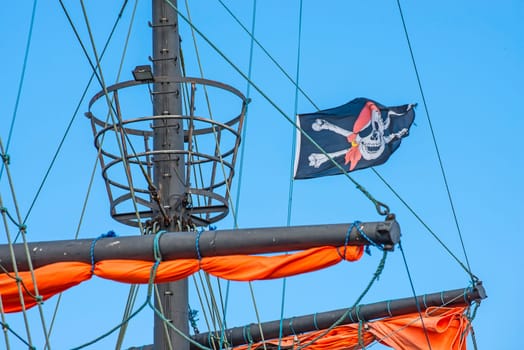 Pirate flag on the sailing ship.