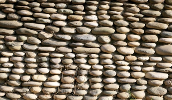 texture on the wall of the large sea pebbles