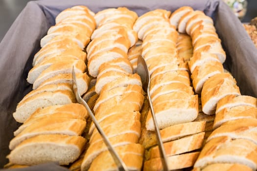 Slices of white bread with pliers