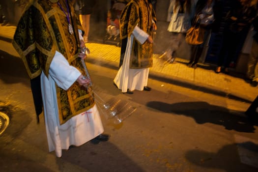 Altar boys with silver censers to burn incense in the holy week, Spain