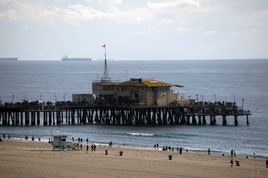 Santa Monica,United States - December 28,2015: Santa Monica Beach and Santa Monica Pier with visitors and tourists on December 28,2015 in Santa Monica.