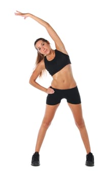 Happy young woman holding doing exercise and stretching over white