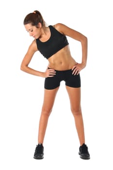 Happy young woman holding doing exercise and stretching over white