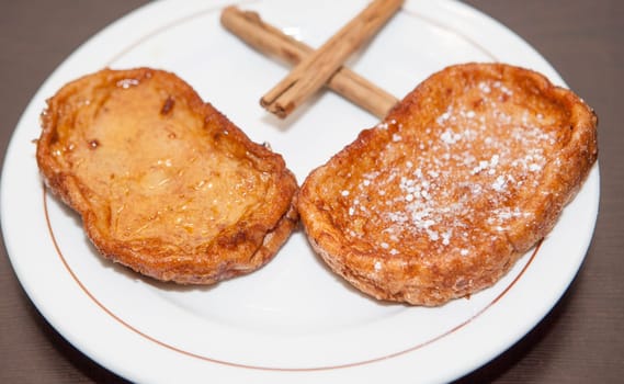 Traditional Holy week torrijas on plate, Spain