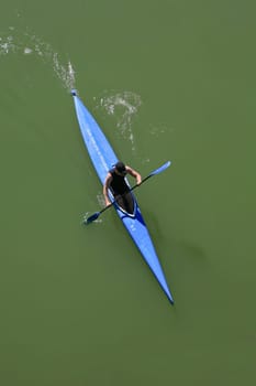 Kayak sportman taken from one of the bridges over the Guadalquivir River, Spain
