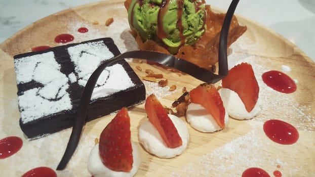 close-up Brownies with Green tea Ice-cream and strawberry in thailand