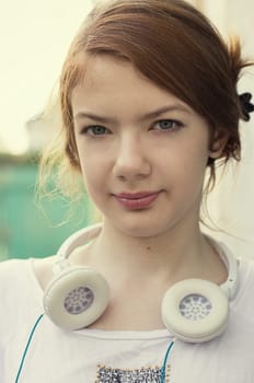 charming girl teen posing outdoors in bright sunlight