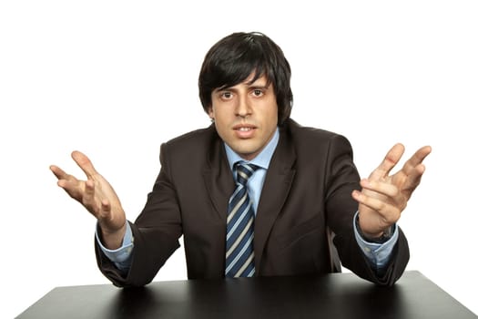 young business man on a desk, isolated on white