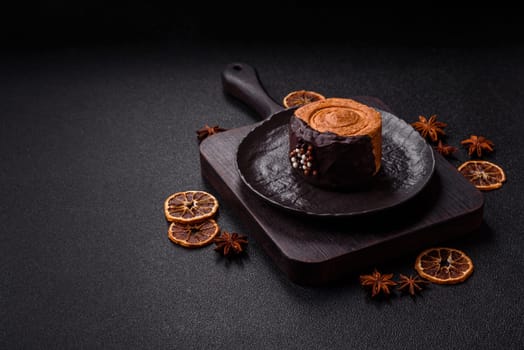 Round sweet New York roll croissant with chocolate cream filling on a dark concrete background