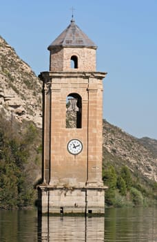 steeple of the ebro reservoir sunken village