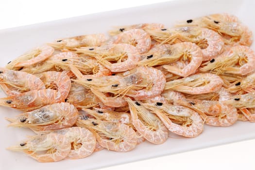 dried shrimp on plate isolated on white background