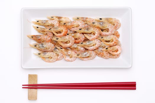 dried shrimp with chopsticks on white background