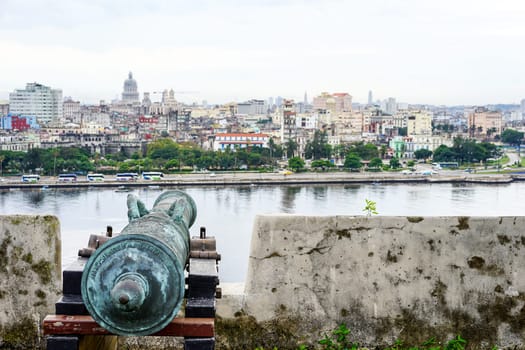 old antique cannon overlooking the blurring city of havana, Cuba