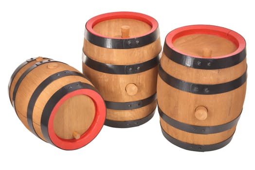 three old beer barrels with red rings insulated on white