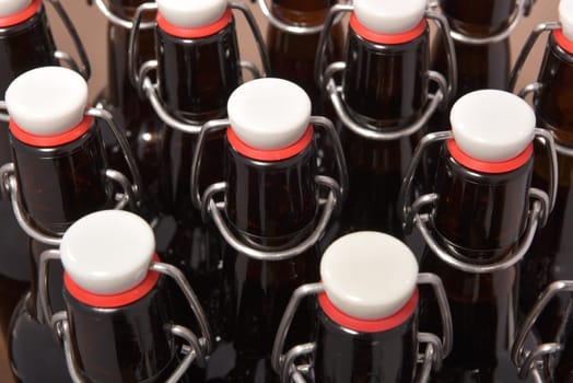 Close-up of many beer bottles with ironing closure