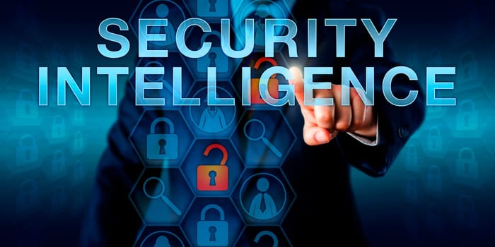 Manager is pushing SECURITY INTELLIGENCE on a touch screen. Security technology concept for an information security role responsible for the protection of computers, software and networks.