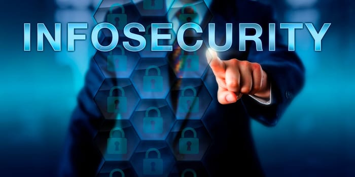 Security specialist touching INFOSECURITY onscreen. Technology and business concept for information security, computer security, information technology security and protection of critical data.
