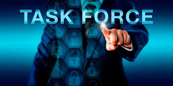Forensic expert is pressing TASK FORCE on a touch screen interface. Business metaphor and law enforcement technology concept. Icons onscreen refer to peer experts, investigative tools and coding..