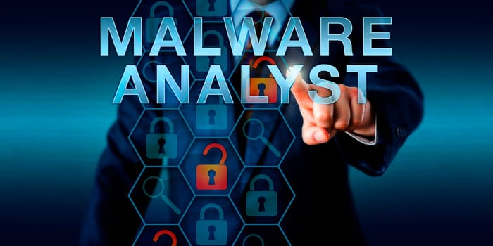 Security director touching MALWARE ANALYST onscreen. Security technology concept for a corporate analytical role in cybersecurity responsible for identifying and analyzing malicious program threats.
