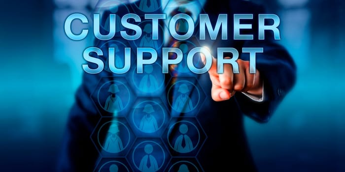Businessman touching CUSTOMER SUPPORT. Business and technology concept for the services industry. Male and female white collar icons embedded in a hexagonal matrix represent the customer base.