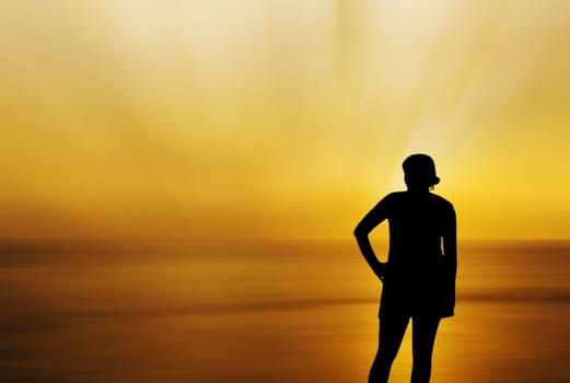 Silhouette the women on the beach with sea storm blurred background, Over dark tone