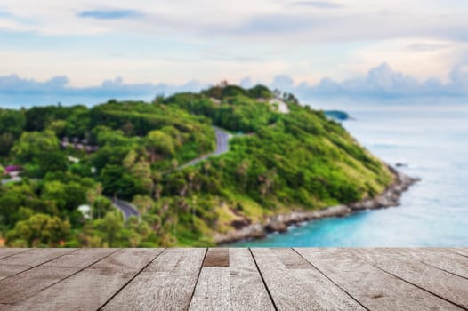 Wood table top on blurred blue sea and island view point in morning light, Can be used for display or montage your products