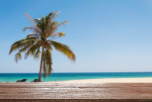 Wood table top on blurred blue sea and white sand beach - Can be used for display or montage your products