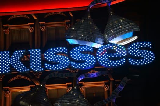 Las Vegas,United States - December 23,2015: The illuminated lettering of Kisses above the entrance of Hershey's chocolate world decorated with lamps and hoods on December 23,2015 in Las Vegas.