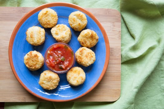 Crispy breaded fried tapas with a tomato dipping sauce.