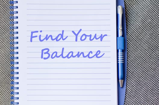 Find your balance text concept write on notebook with pen